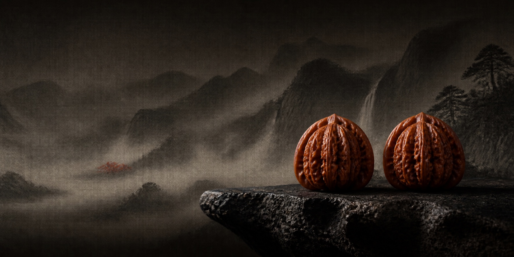 A matched pair of collectible Chinese walnuts within a misty ink-wash mountain landscape